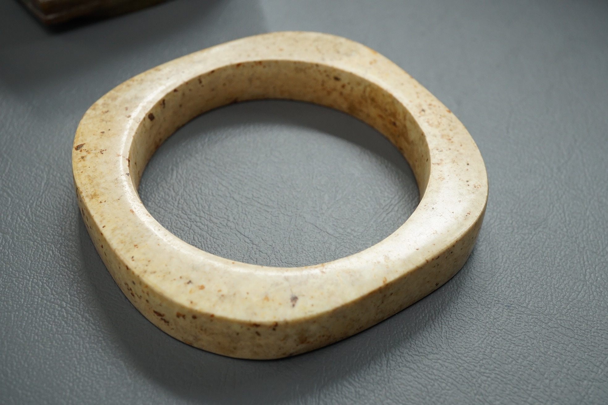 Four Chinese archaistic hardstone or burnt jade cong or cylinders